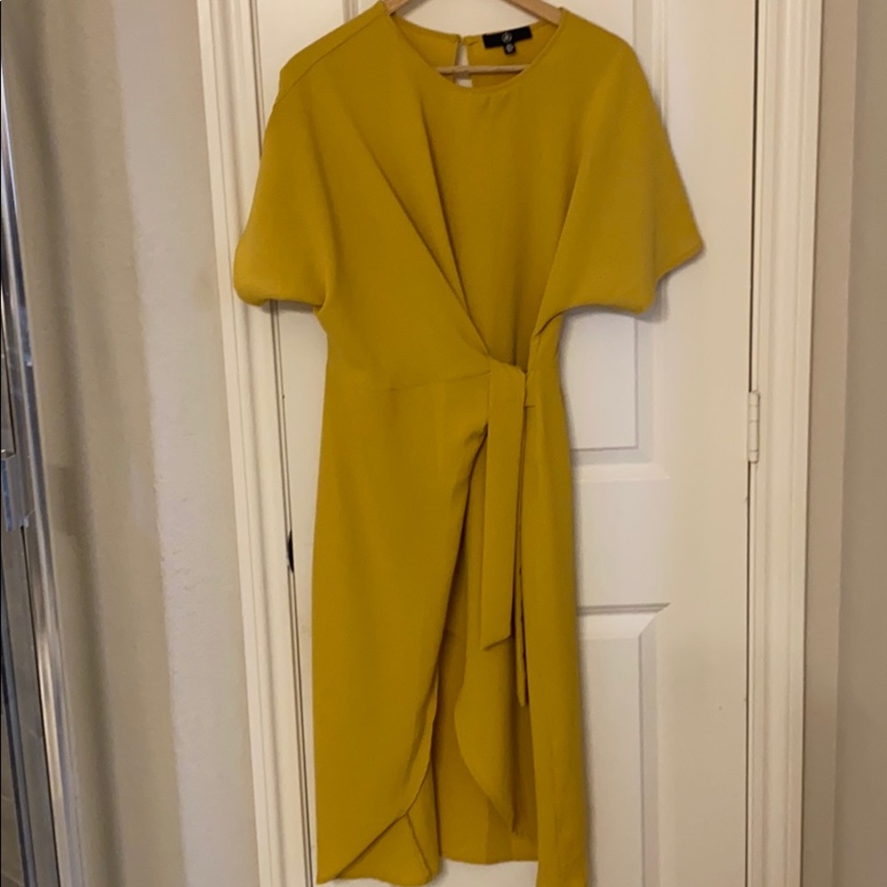 Mid length tie in front dress with slit on leg